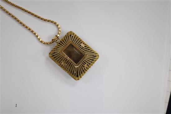 A continental yellow metal mounted smoky quartz pendant, on an 18ct gold chain, pendant 29mm.